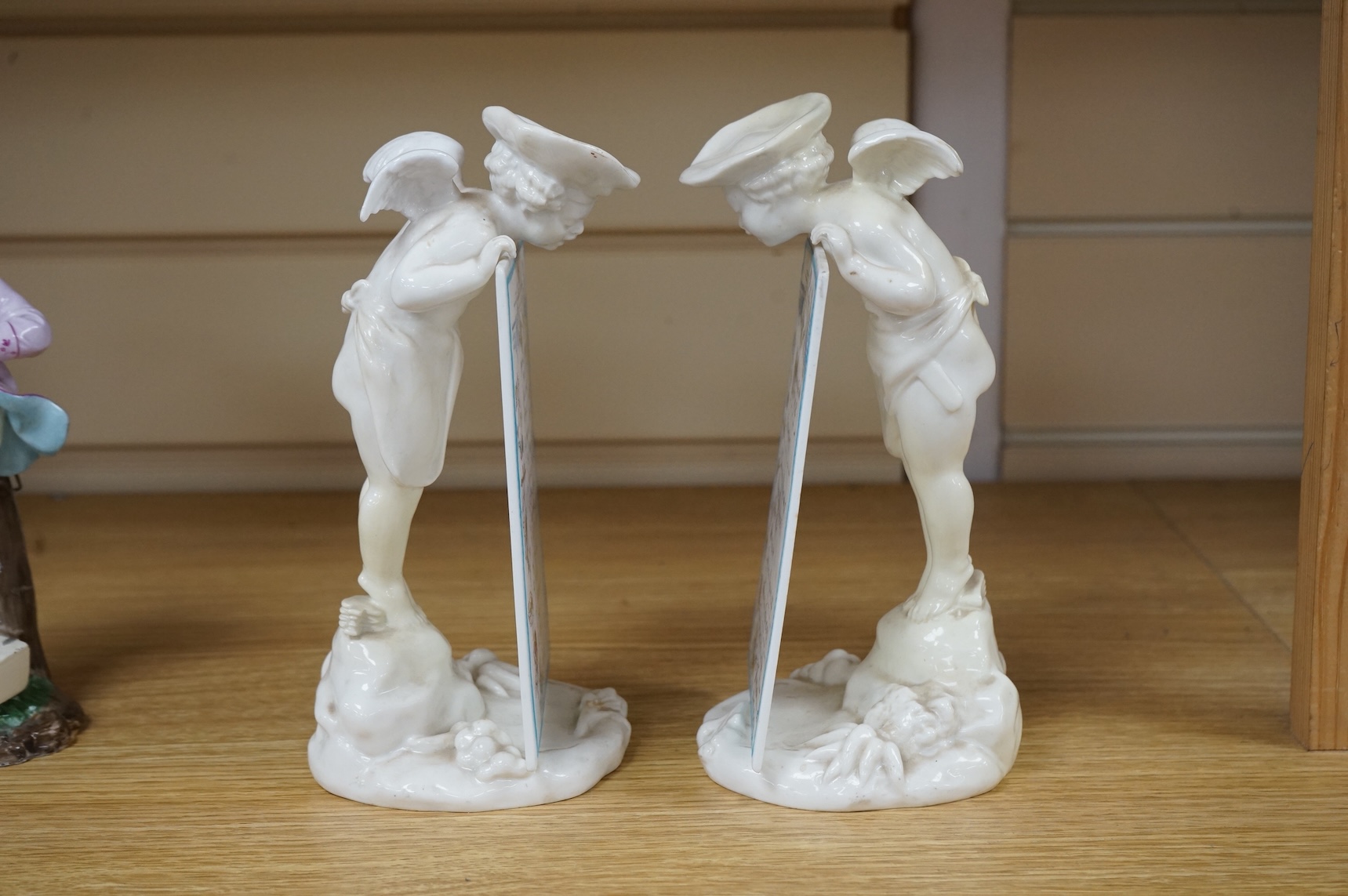 A pair of 19th century Mintons white glazed porcelain figural menu holders, 20cm